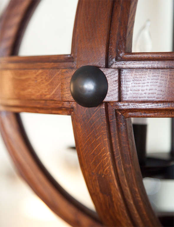 Smaller version of the large oak sphere. Shown in carved white oak with medium walnut finish and metal in oil rubbed bronze finish.